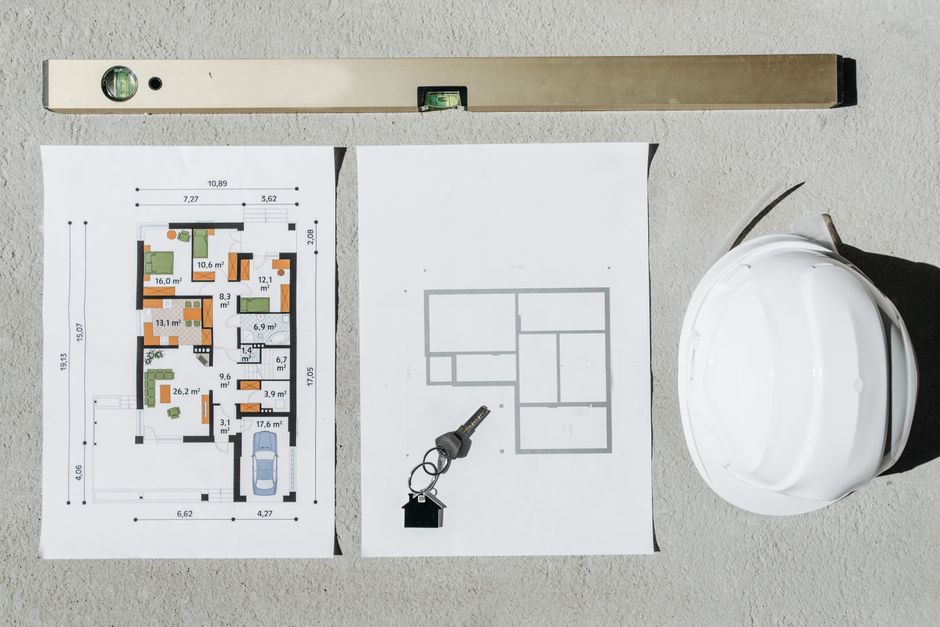 A close-up flat lay image of a single house key resting on a detailed city map, symbolizing the navigation of local short-term rental regulations.